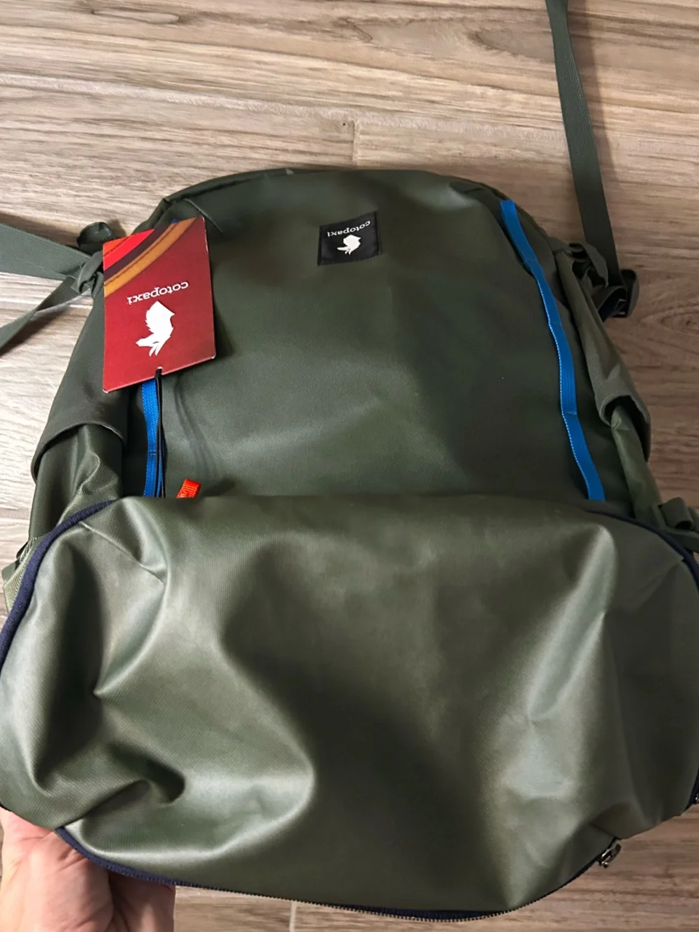 cotopaxi Olive Green Backpack with Blue and Teal Accents